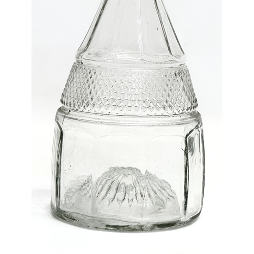 495 - A 1920’s Art Deco glass decanter. 26cm