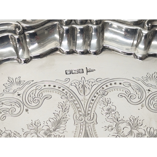 590A - A large Sheffield silver salvar, Walker & Hall 1905. 709 grams. 30.5cm