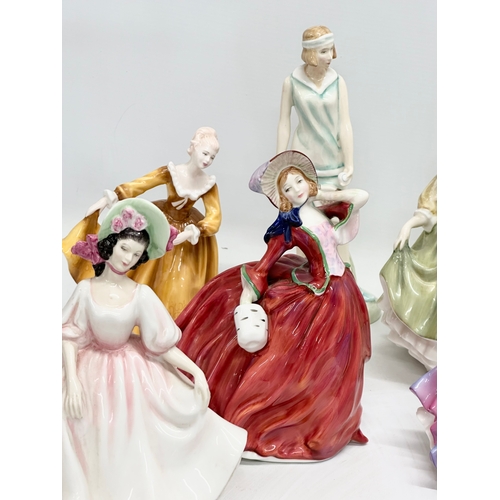 905 - A collection of Royal Doulton figurines. 28cm. 24cm. 22cm. 21cm. 11 figurines.