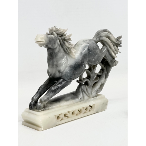 937 - A pair of Chinese soapstone horses. 21x19cm