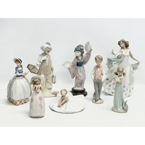 938 - A collection of Lladro and NAO figurines. 32cm. 30cm. 29cm. 24cm. 23cm