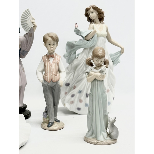 938 - A collection of Lladro and NAO figurines. 32cm. 30cm. 29cm. 24cm. 23cm