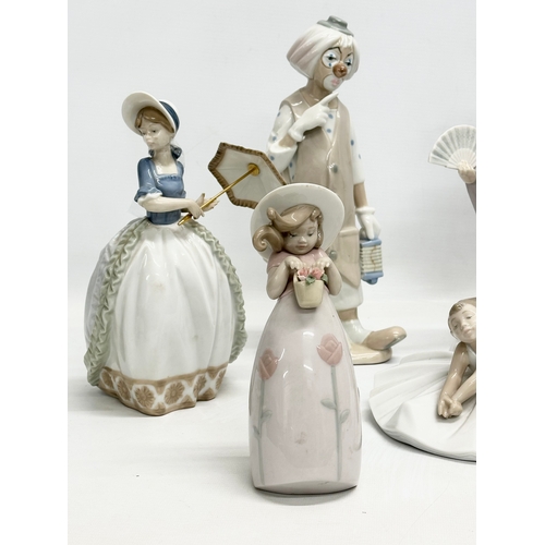 938 - A collection of Lladro and NAO figurines. 32cm. 30cm. 29cm. 24cm. 23cm