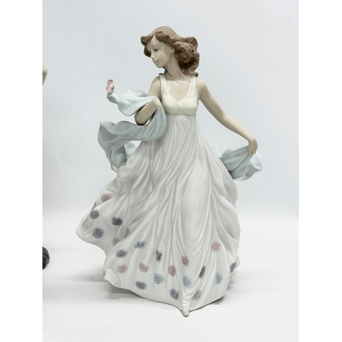 938 - A collection of Lladro and NAO figurines. 32cm. 30cm. 29cm. 24cm. 23cm