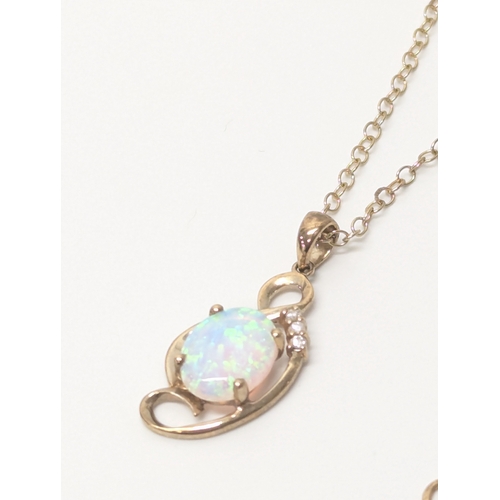 590G - 9ct gold diamond & opal necklace 2.9 grams with a small  14ct gold chain 0.5 grams