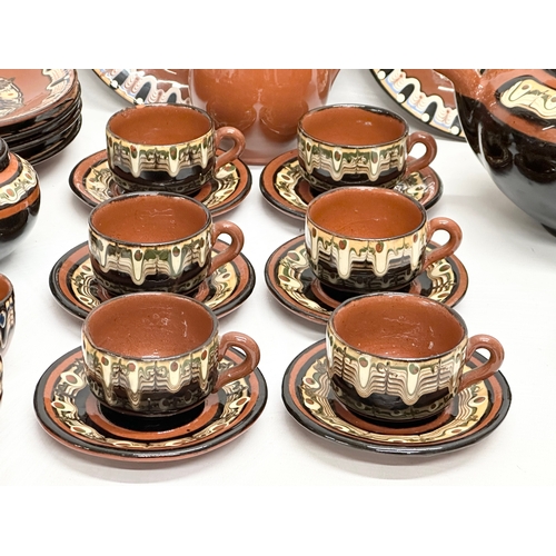 713 - A Mid 20th Century Bulgarian pottery glazed clay “Troyan” tea service. 29 piece.