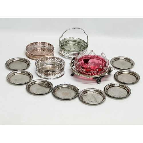 950B - A collection of Late 19th and 20th Century silver plate. A Victorian cranberry glass dish, coasters ... 