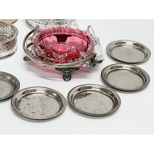 950B - A collection of Late 19th and 20th Century silver plate. A Victorian cranberry glass dish, coasters ... 