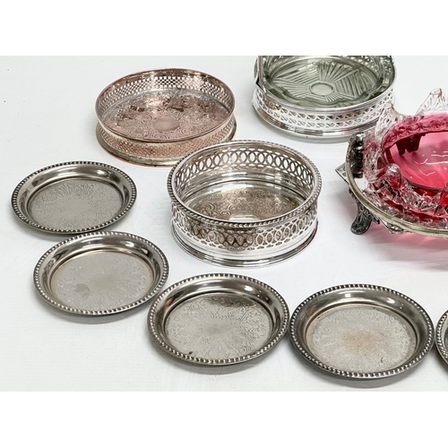 950B - A collection of Late 19th and 20th Century silver plate. A Victorian cranberry glass dish, coasters ... 