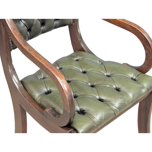 370B - A Regency style mahogany deep button back leather armchair.