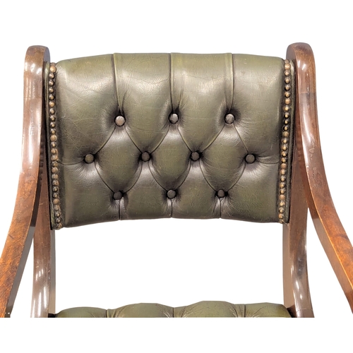 370B - A Regency style mahogany deep button back leather armchair.