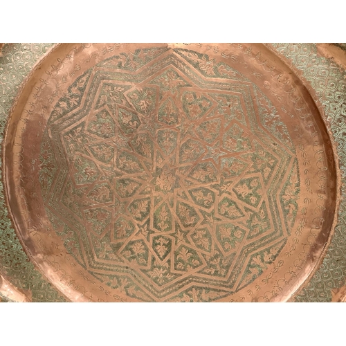 384 - A very large Late 19th Century Moroccan copper tray plaque. 96cm