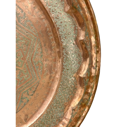 384 - A very large Late 19th Century Moroccan copper tray plaque. 96cm