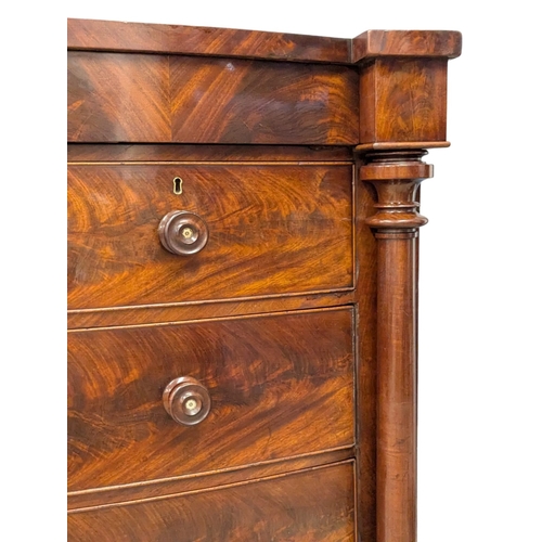 390B - A large good quality 19th Century Victorian flamed mahogany bow front chest on drawers with Doric co... 