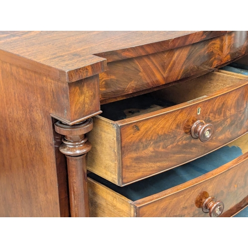 390B - A large good quality 19th Century Victorian flamed mahogany bow front chest on drawers with Doric co... 