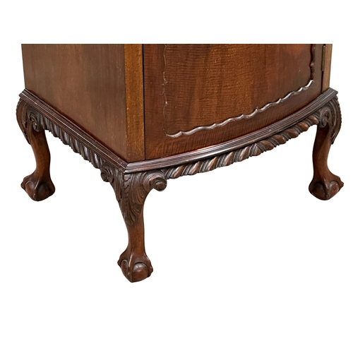 405 - A 1930’s Chippendale Revival mahogany bow front pedestal side cabinet. 52x43x94cm