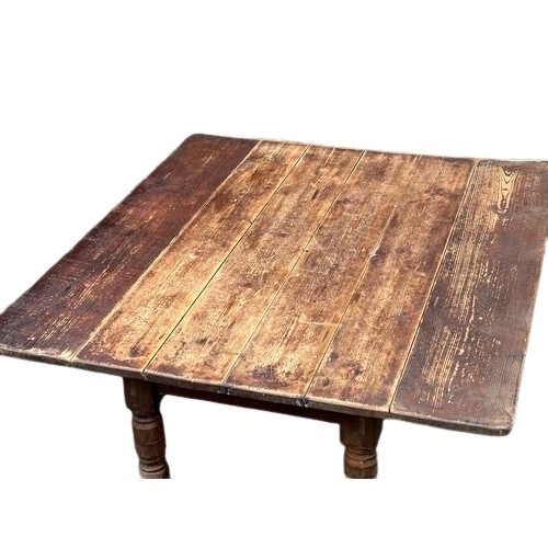 424 - A Victorian farmhouse kitchen drop leaf dining table. Open 108x122x76cm. Closed 68x122x76cm