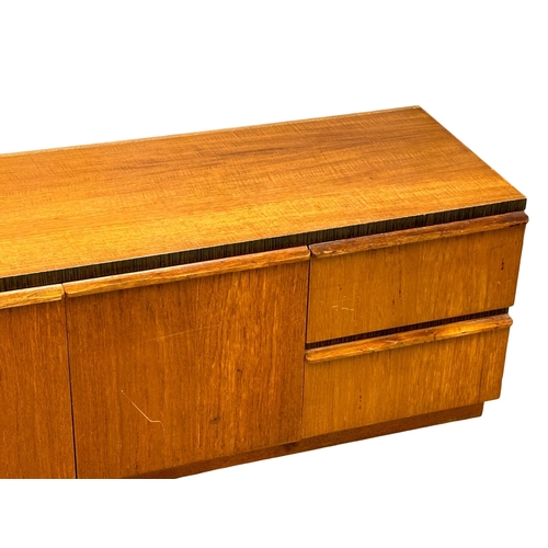 428 - A Mid Century teak lowboard. 180x51x56cm