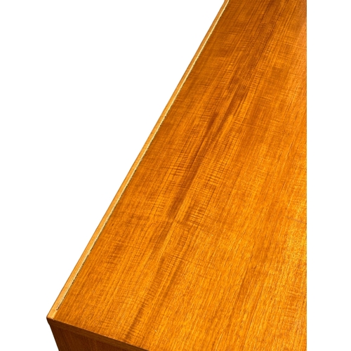 428 - A Mid Century teak lowboard. 180x51x56cm