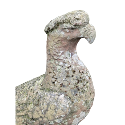 464 - A pair of concrete garden eagles. 30x94cm