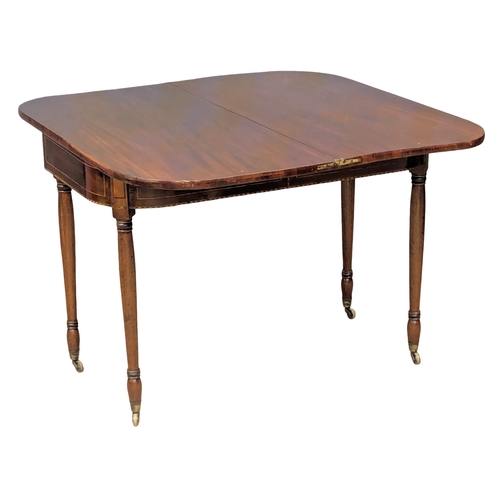 473 - An Early 19th Century George IV inlaid mahogany turnover tea table on turned legs. Circa 1820. 103x5... 