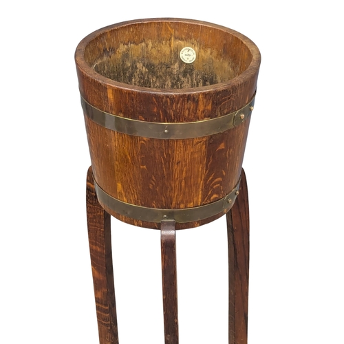 474 - An Early 20th Century oak planter on stand.