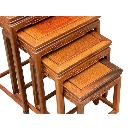 523 - A set of 4 Chinese teak nest of tables. 51x35x66cm