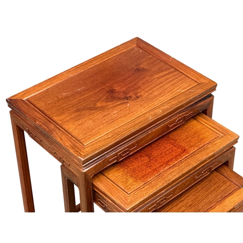 523 - A set of 4 Chinese teak nest of tables. 51x35x66cm