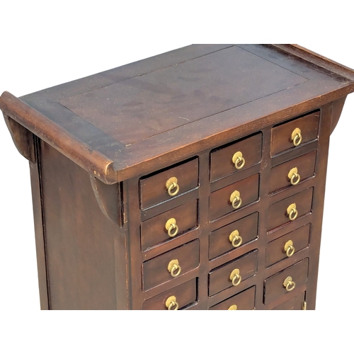 809 - A Chinese multi-drawer chest. 55x31x77cm. 2