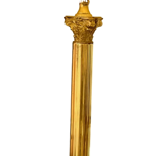 820 - A brass standard lamp with Corinthian style column.