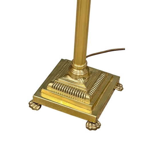 820 - A brass standard lamp with Corinthian style column.