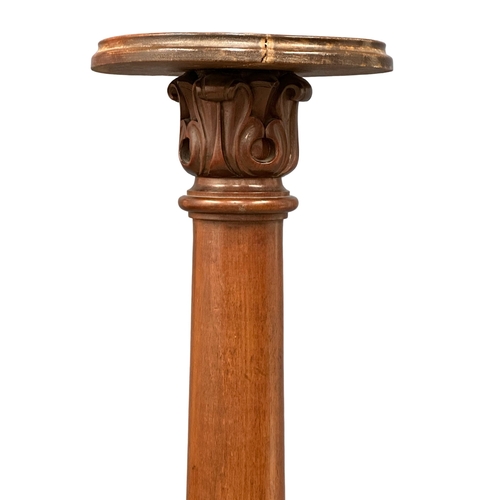 823 - A 19th Century Victorian mahogany torchere with later top and base. 126cm