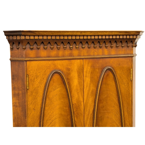 826 - A Georgian style mahogany corner cocktail cabinet. 66x173cm