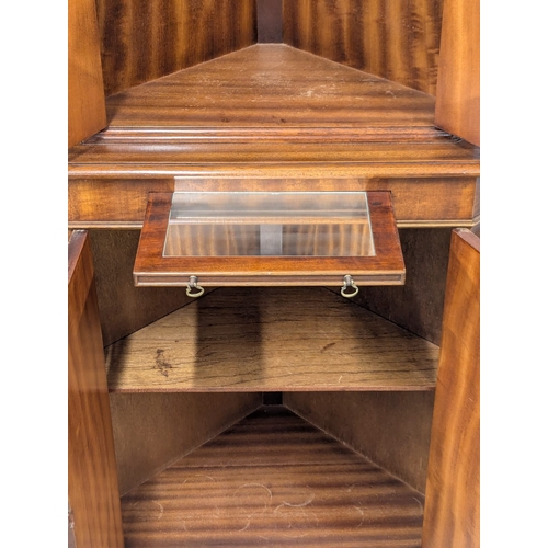 826 - A Georgian style mahogany corner cocktail cabinet. 66x173cm