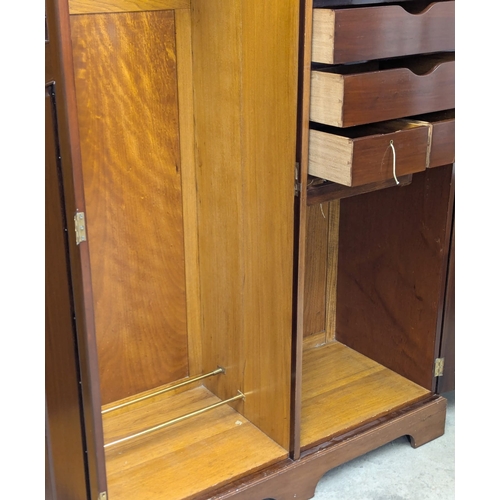 852 - An Early 20th Century mahogany fitted wardrobe. 129x55x188cm. 1