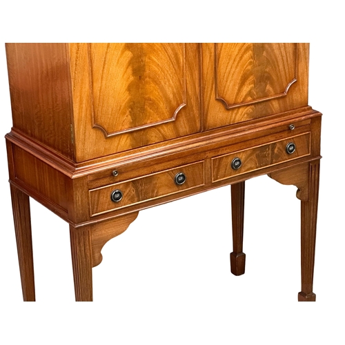 510A - A Georgian style mahogany cocktail cabinet with maple interior, brushing slide and 2 drawers.  83x42... 