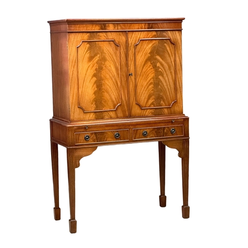 510A - A Georgian style mahogany cocktail cabinet with maple interior, brushing slide and 2 drawers.  83x42... 