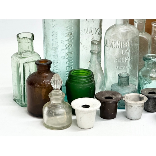 738 - A large collection of Late 19th and Early 20th Century glass bottles and stoneware bottles etc.