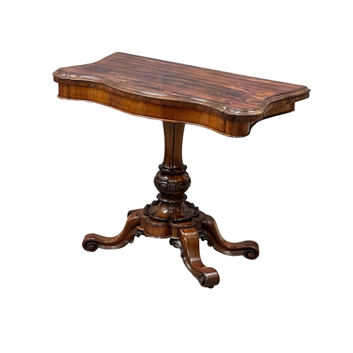 870A - A 19th Century Victorian rosewood turnover tea table. 92x46x74cm. 2