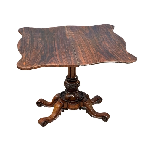 870A - A 19th Century Victorian rosewood turnover tea table. 92x46x74cm. 2