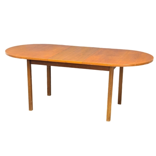 948 - A Mid Century teak extending dining. 195x91x75cm (6)