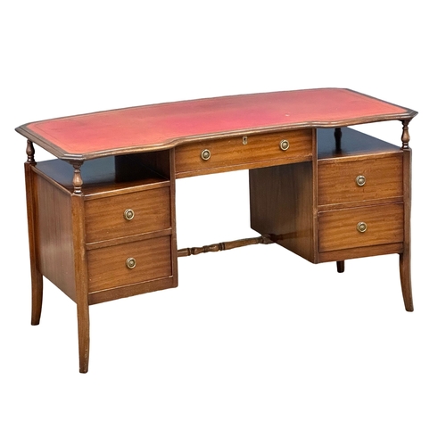 966 - A Mid 20th Century mahogany writing desk with leather top. 138x70x77cm (4)