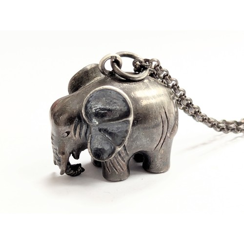 A silver elephant pendant & chain