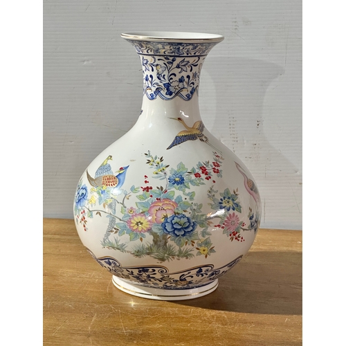 667 - A Francesco Guarino pottery vase. Italy. 30cm