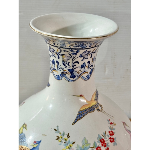 667 - A Francesco Guarino pottery vase. Italy. 30cm