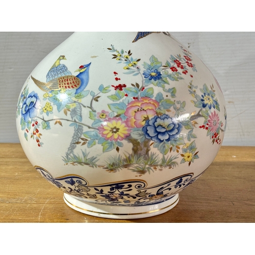 667 - A Francesco Guarino pottery vase. Italy. 30cm