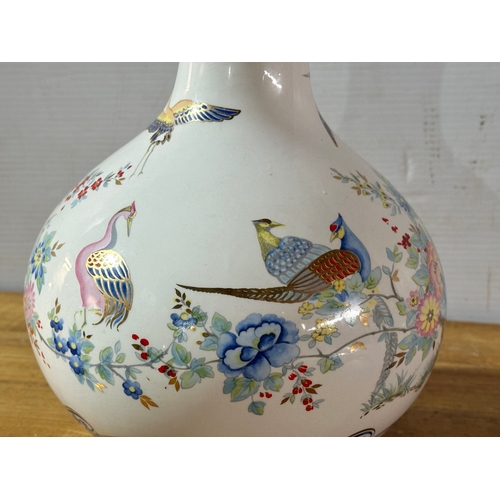 667 - A Francesco Guarino pottery vase. Italy. 30cm