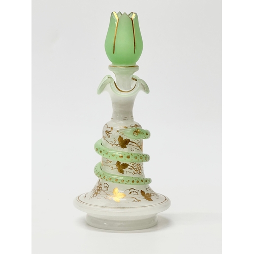 4 - Baccarat. A 19th Century French opaline glass “Snake Trail” perfume bottle. C.1860. With gilt flower... 