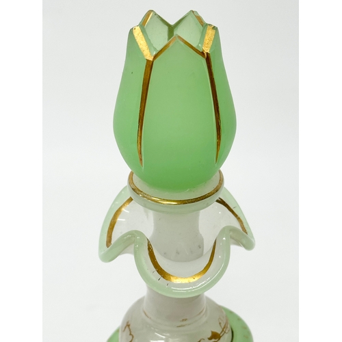 4 - Baccarat. A 19th Century French opaline glass “Snake Trail” perfume bottle. C.1860. With gilt flower... 