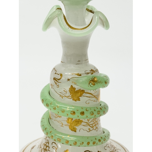 4 - Baccarat. A 19th Century French opaline glass “Snake Trail” perfume bottle. C.1860. With gilt flower... 